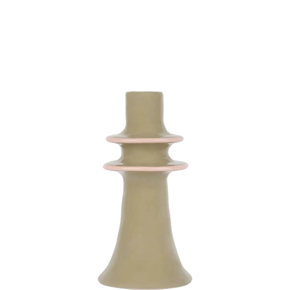 A minimalist ceramic candle holder with a matte sage green body and delicate light pink rings, set against a clean white background.