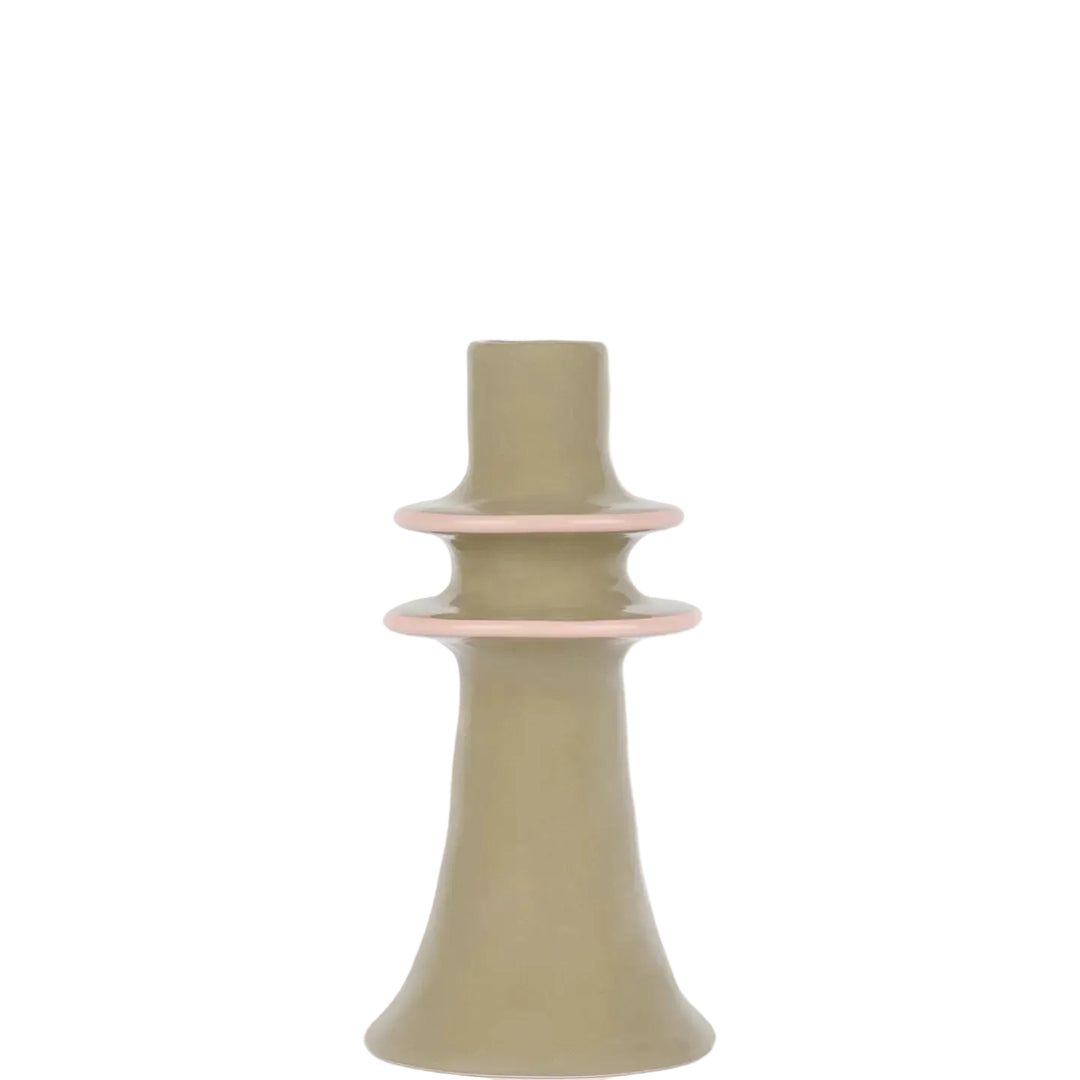 A minimalist ceramic candle holder with a matte sage green body and delicate light pink rings, set against a clean white background.