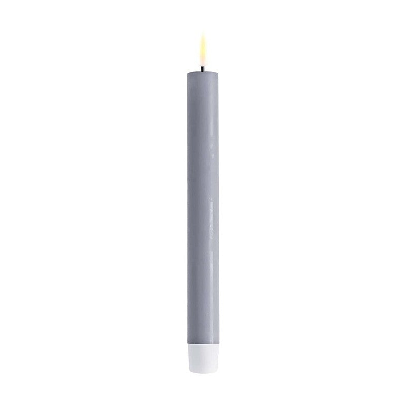 Pair of dusty blue LED dinner candles from Cornucopia Home and Gift Deluxe Home Art collection, showcasing realistic flickering light.