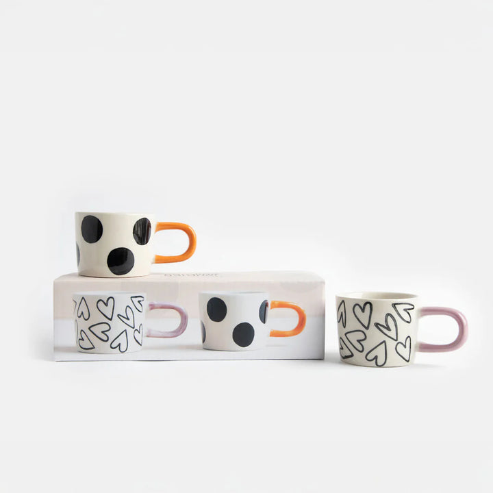 Pair of Caroline Gardner mono spot and hearts espresso cups featuring stylish designs, perfect for gifting or everyday use.