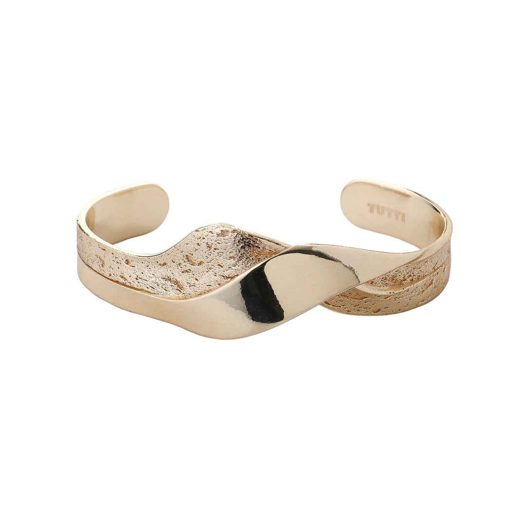 Gold Wave Bangle by Tutti & Co featuring a sleek, wavy design, perfect as a stylish jewelry accessory.