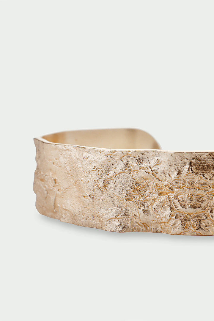 Gold Revere Bangle by Tutti &amp; Co featuring a sleek, polished design, perfect for elegant wrist accessories.