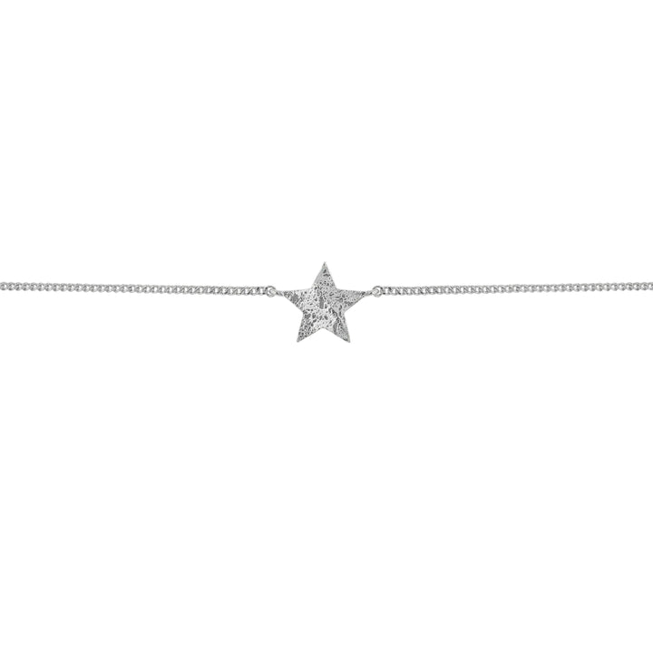 Star-shaped pendant on a chain against a white background