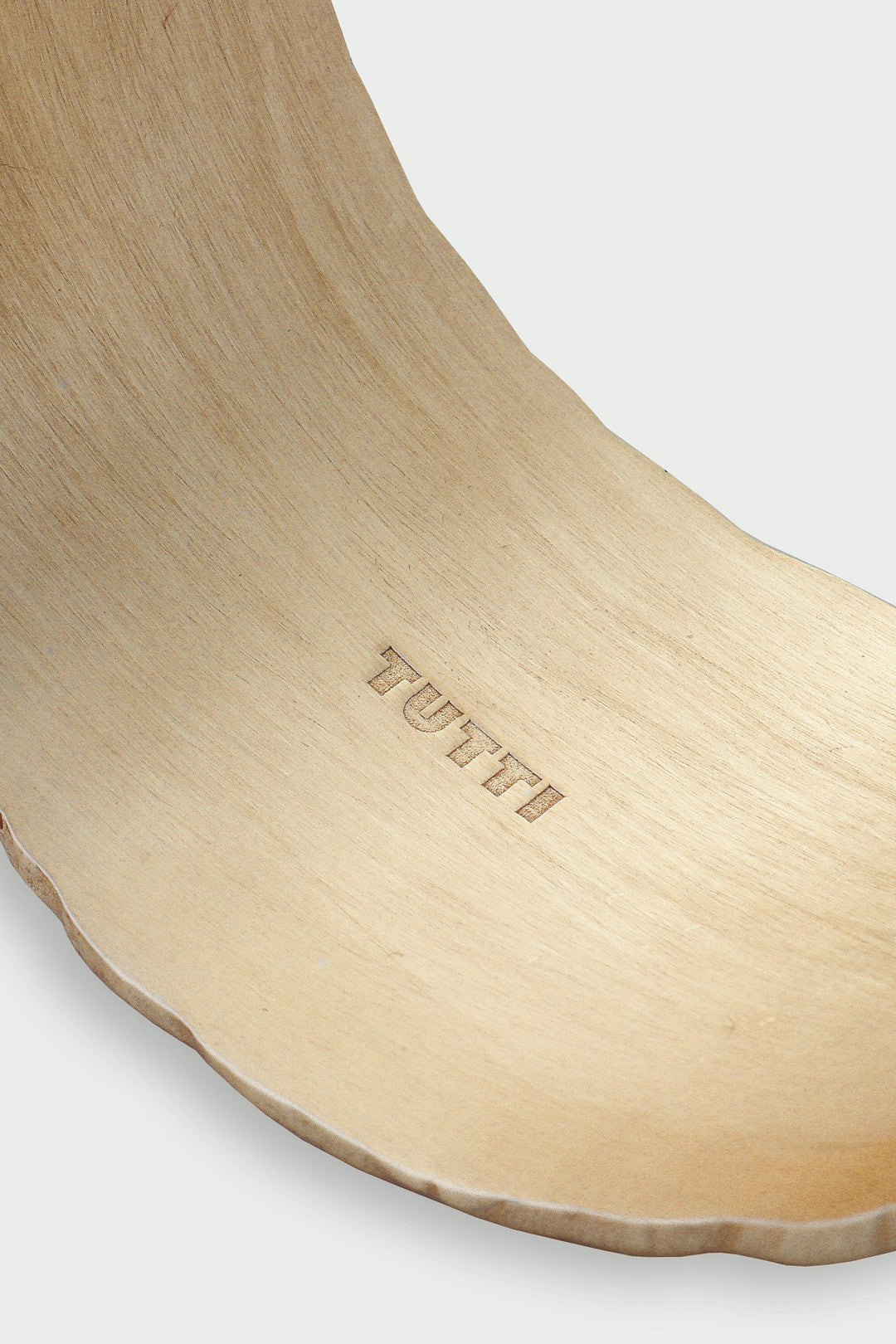 Gold Arc Cuff Bracelet by Tutti &amp; Co, featuring a sleek, minimalist design with smooth curves, on a neutral background.
