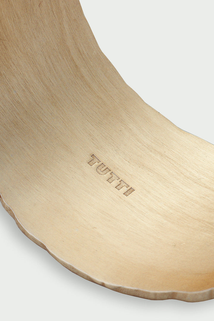 Gold Arc Cuff Bracelet by Tutti &amp; Co, featuring a sleek, minimalist design with smooth curves, on a neutral background.