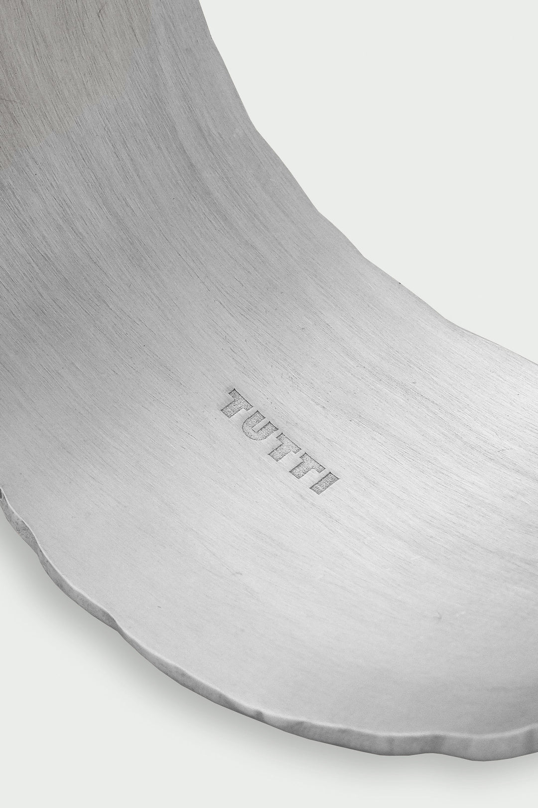 Silver Arc Cuff Bracelet by Tutti &amp; Co featuring a sleek, minimalist design with a smooth, curved silhouette.