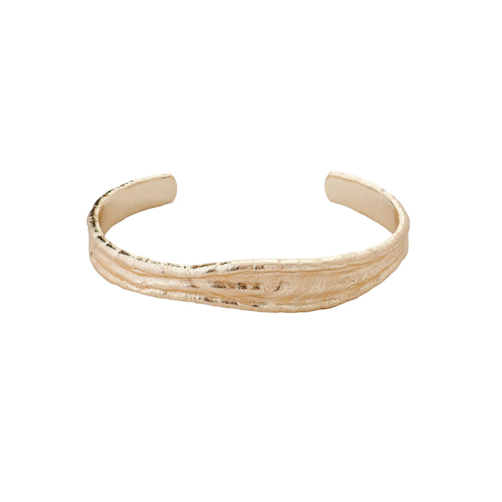 Gold Driftline Bangle by Tutti &amp; Co featuring a sleek, modern design, perfect for stylish wrist accessorizing.