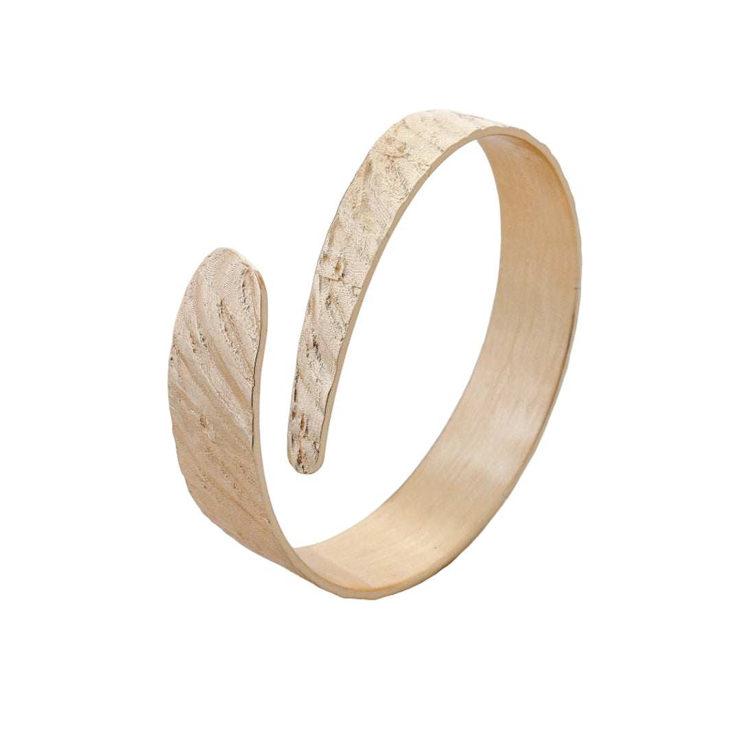 Silver Riva Bangle by Tutti & Co featuring a sleek, minimalist design, displayed on a neutral background.