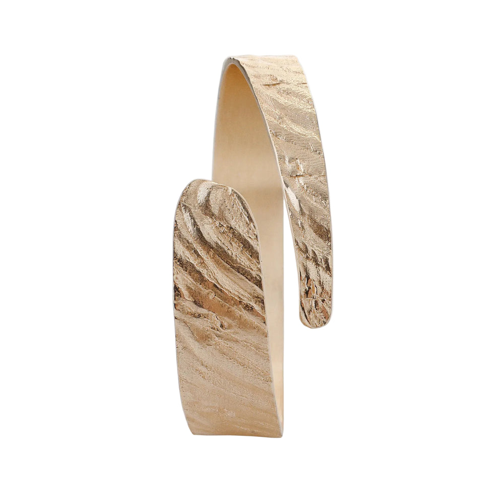 Tutti & Co Riva Bangle with textured gold finish, stylish jewelry accessory displayed on a neutral background.