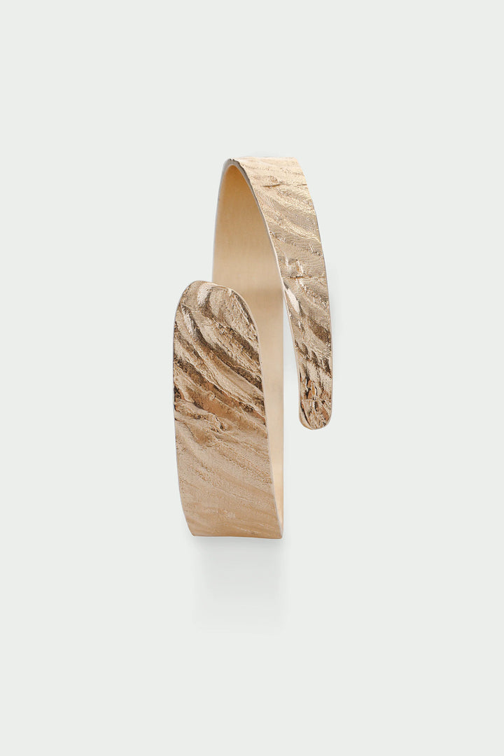 Tutti &amp; Co Riva Bangle with textured gold finish, stylish jewelry accessory displayed on a neutral background.