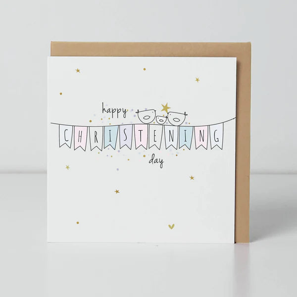 Decorative belly button badge with "Happy Christening Day" design by Cornucopia Home and Gift, featuring colorful, festive details.