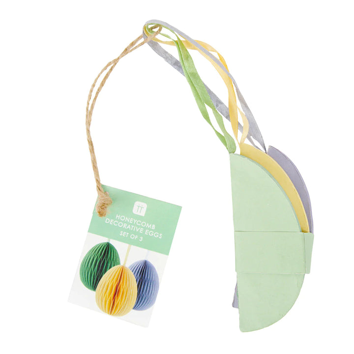 Three hanging honeycomb egg decorations with bunny designs by Talking Tables Easter, featuring pastel colors and textured surfaces.