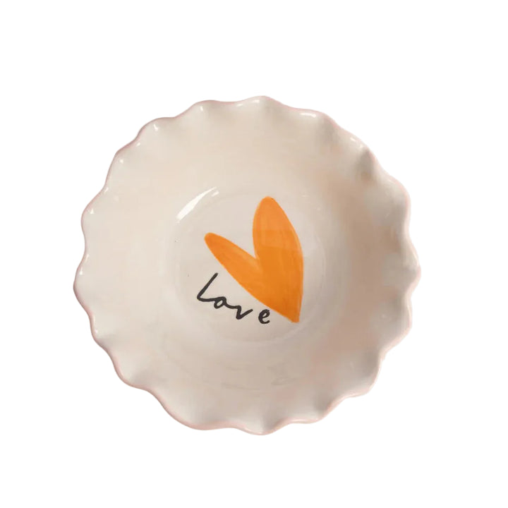 Small ceramic dish with an orange heart and black &