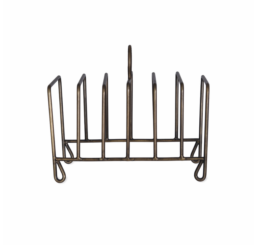 Garden Trading Brompton toast rack in antique brass, with a classic design for organizing toast on a kitchen countertop.