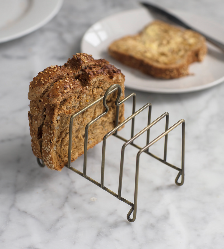 Antique brass Brompton toast rack by Garden Trading, featuring a classic design with multiple slots for toasting bread.