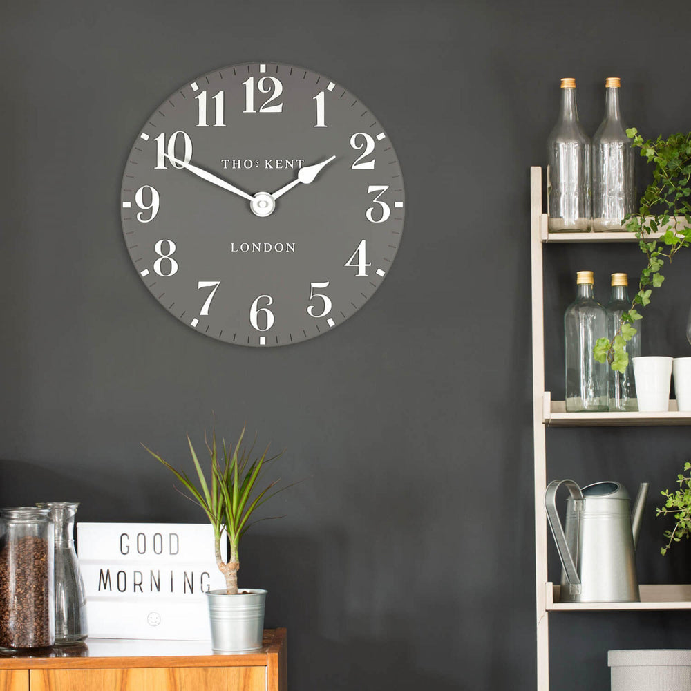 12-inch Arabic wall clock featuring dolphin design by Cornucopia Home and Gift, decorative art piece for home decor.