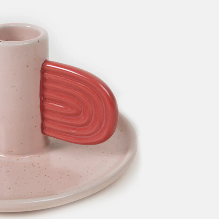 Pink and red Caroline Gardner candle holder from Cornucopia Home and Gift, decorative ceramic piece with floral design.