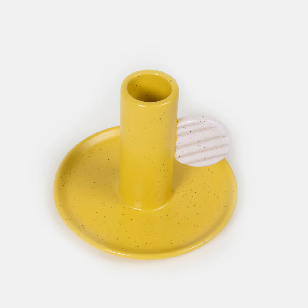 Mustard yellow Caroline Gardner candle holder with a sleek, modern design, perfect for home decor or gifting.