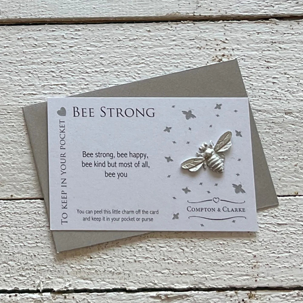 Bee Strong carded pocket charm by Compton &amp; Clarke featuring a bee design on white background for Cornucopia Home and Gift.