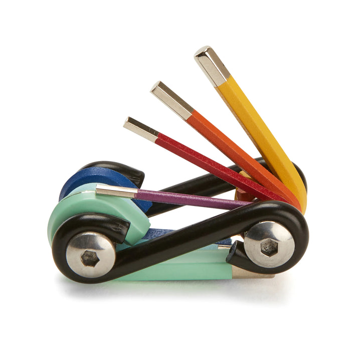 Rainbow 7-in-1 multi-tool by Kikkerland, featuring colorful handles and multiple functions, ideal for versatile everyday use.