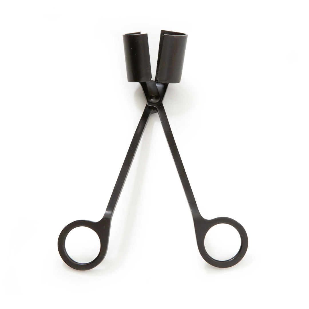 Kikkerland 3-in-1 candle tool with wick trimmer, snuffer, and holder, made for safe and easy candle maintenance.