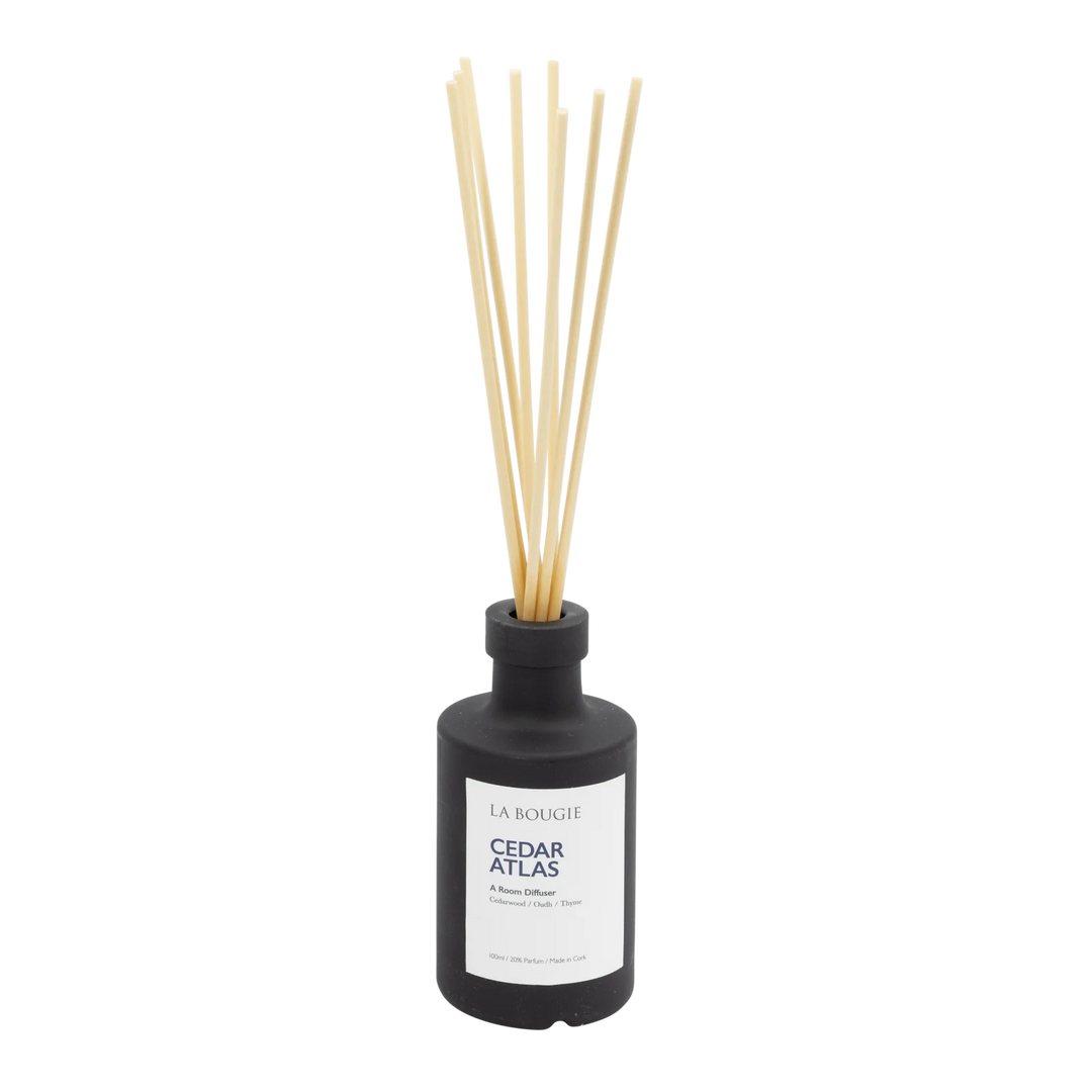 Cedar Atlas Room Diffuser by La Bougie from Cornucopia Home and Gift, featuring a sleek design with a wooden finish and reed sticks.