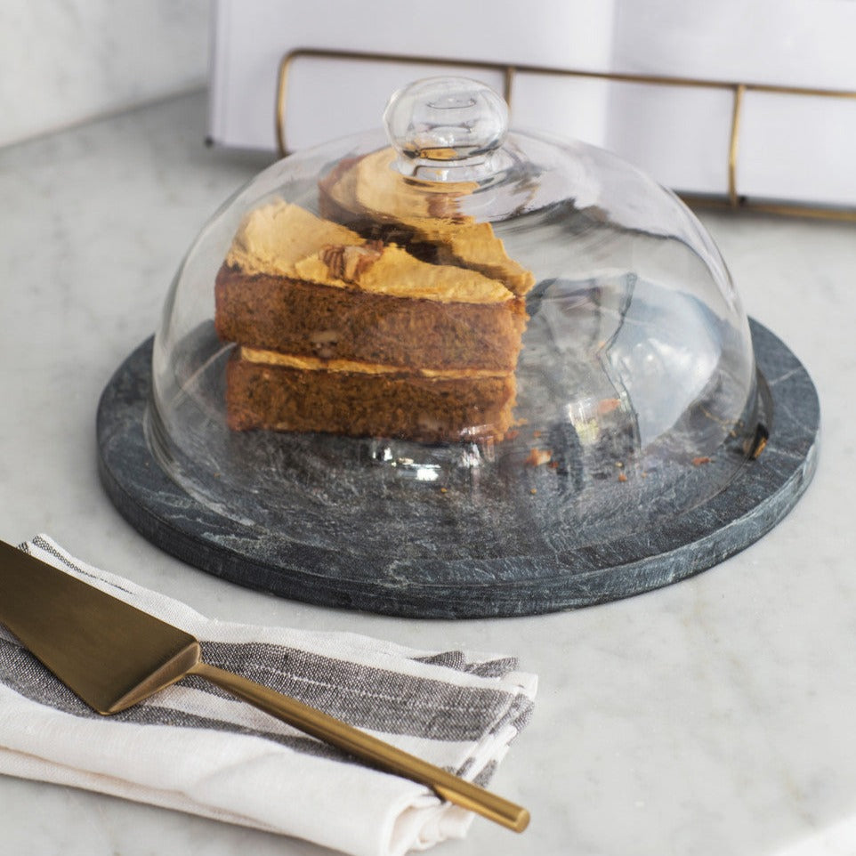 Garden Trading Brompton cake dome with slate base and glass cover, designed by Cornucopia Home and Gift, showcasing an elegant kitchen display.