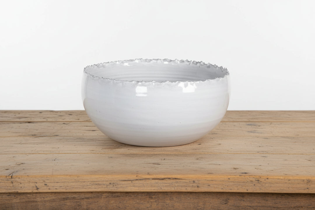 Cornucopia Worcester Coach House distressed edge white ceramic bowl with rustic finish, showcasing its textured ceramic surface and distressed rim.