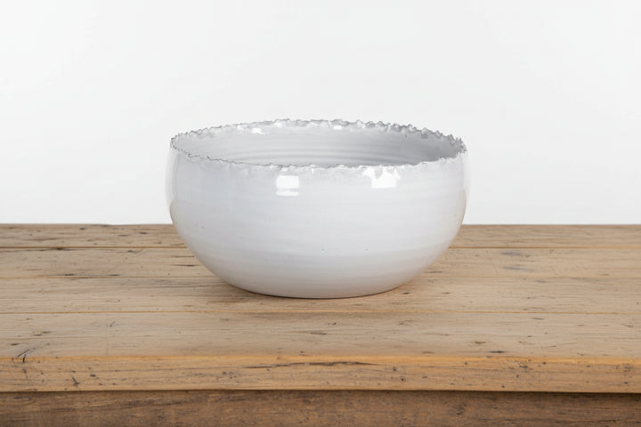 Cornucopia Worcester Coach House distressed edge white ceramic bowl with rustic finish, showcasing its textured ceramic surface and distressed rim.