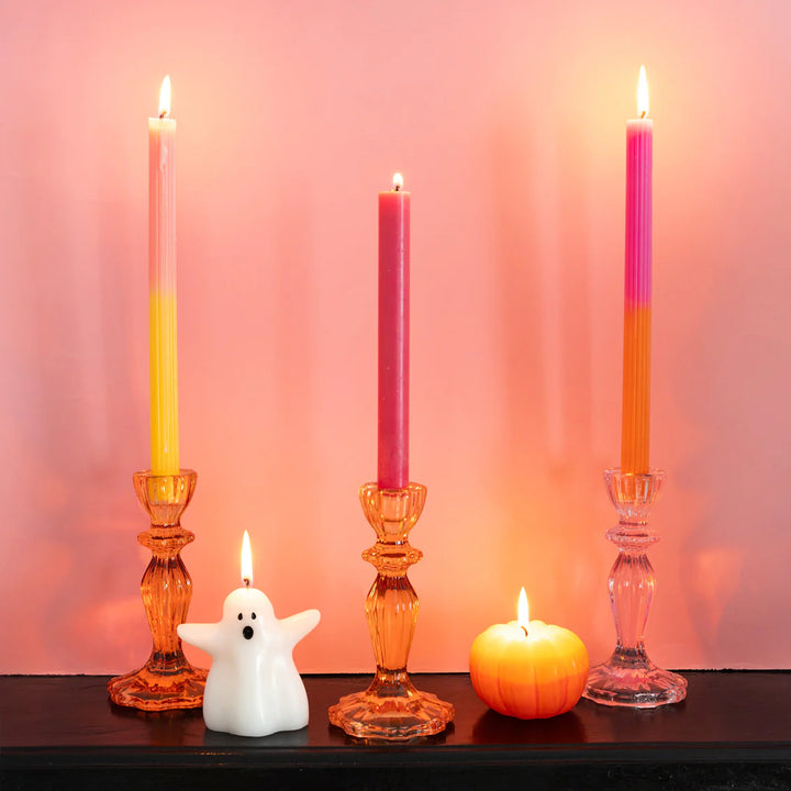 Halloween yellow ombre pumpkin-shaped candle from Cornucopia Home and Gift, featuring a spooky ghost design, perfect for festive decor.