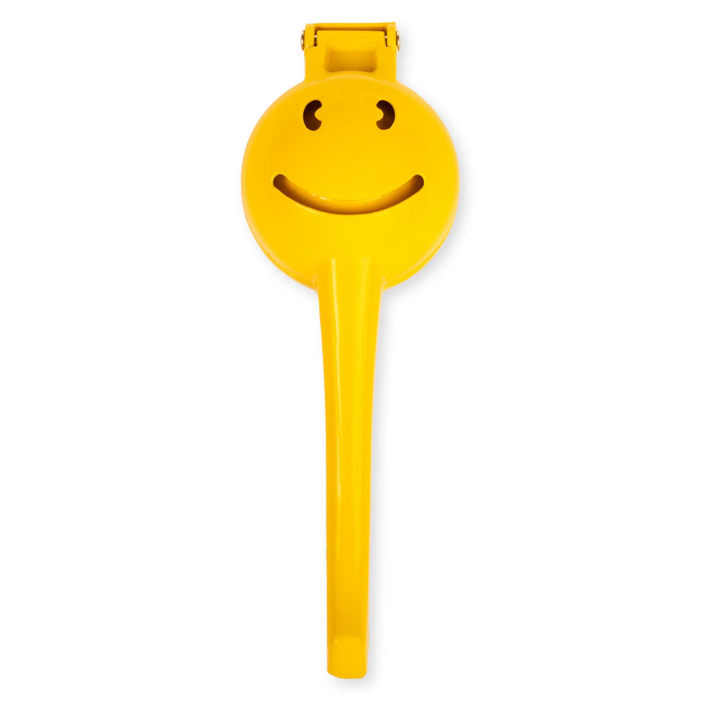 Kikkerland Smiley Face Citrus Squeezer by Cornucopia Home and Gift, white background, cheerful yellow lemon-shaped hand-held juicer