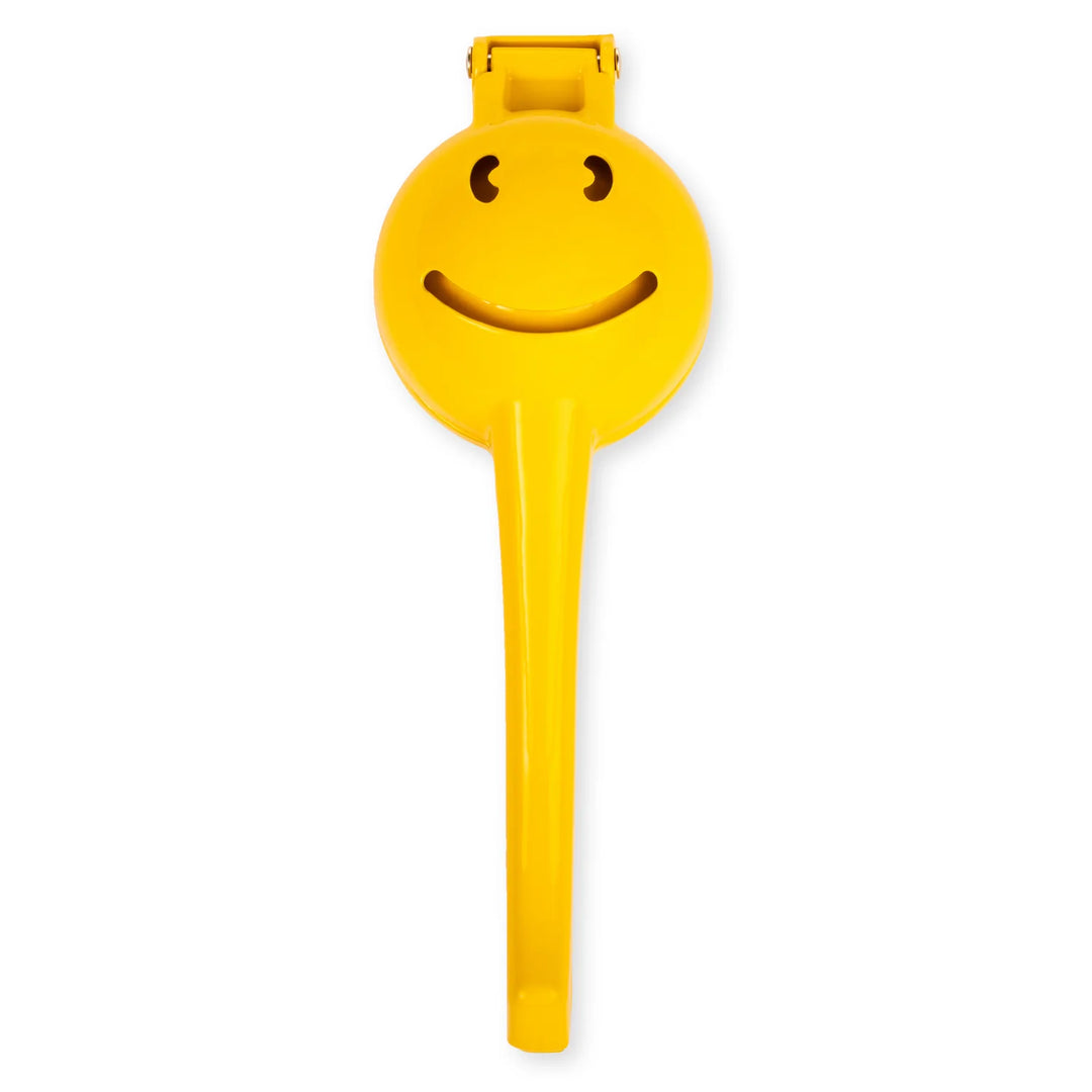 Kikkerland Smiley Face Citrus Squeezer by Cornucopia Home and Gift, white background, cheerful yellow lemon-shaped hand-held juicer