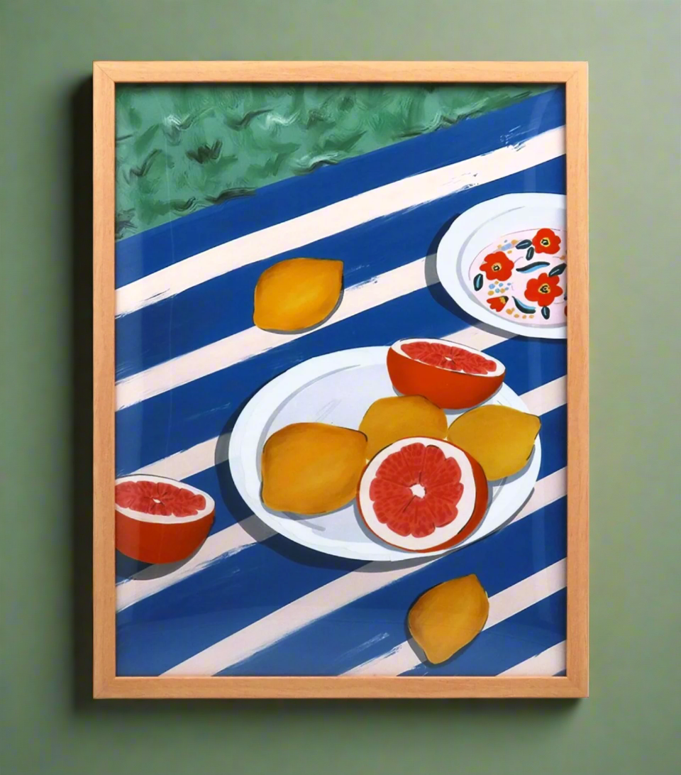 Gisela Graham large citrus plate framed print featuring vibrant lemon and orange illustrations on a white background.