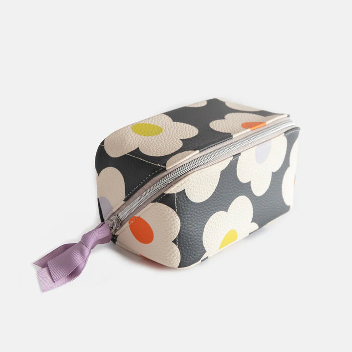 Caroline Gardner multi-flower charcoal diagonal cosmetic bag with floral pattern, ideal for travel and makeup storage.
