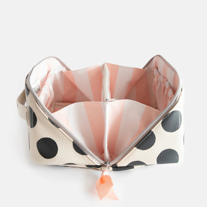 Open Caroline Gardner Scattered Dot Large Diagonal Washbag with colorful dot pattern, showcasing spacious interior and stylish design.