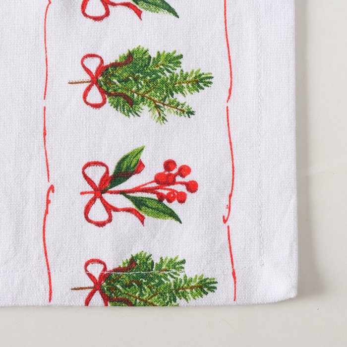 Close-up of the Boltze Christmas Noelle table runner with festive patterns, showcasing intricate fabric details and holiday decoration.