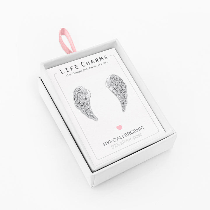 Silver crystal angel wing stud earrings from Cornucopia Home and Gift, featuring delicate angel wing charms and sparkling crystals.