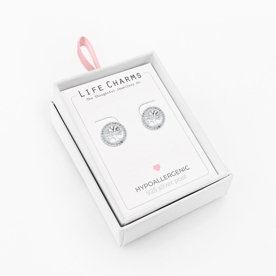 Silver Tree of Life stud earrings featuring intricate leaf designs, perfect as meaningful life charm jewelry.