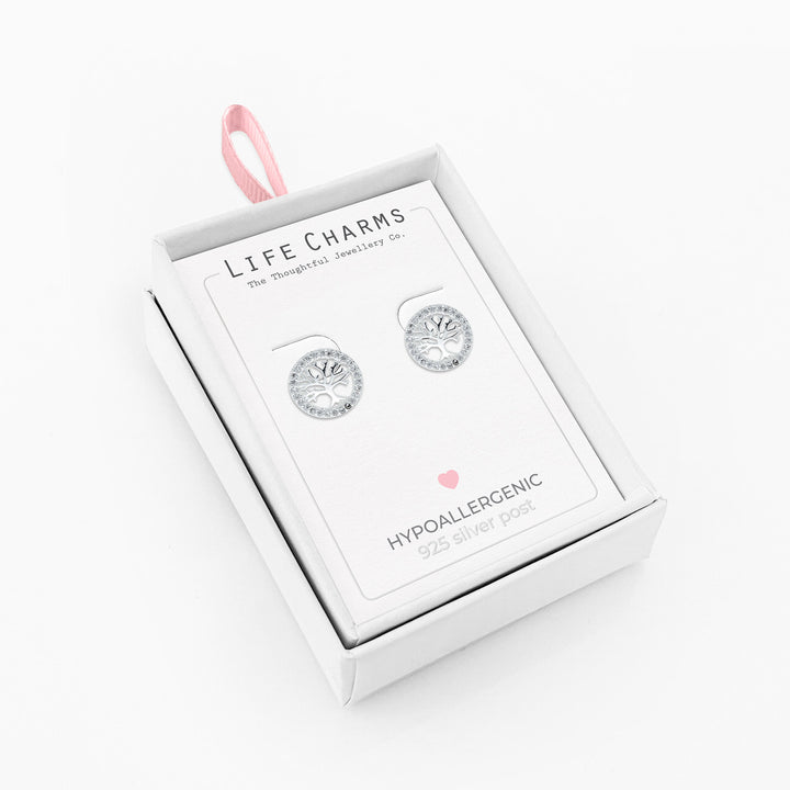 Silver Tree of Life stud earrings featuring intricate leaf designs, perfect as meaningful life charm jewelry.
