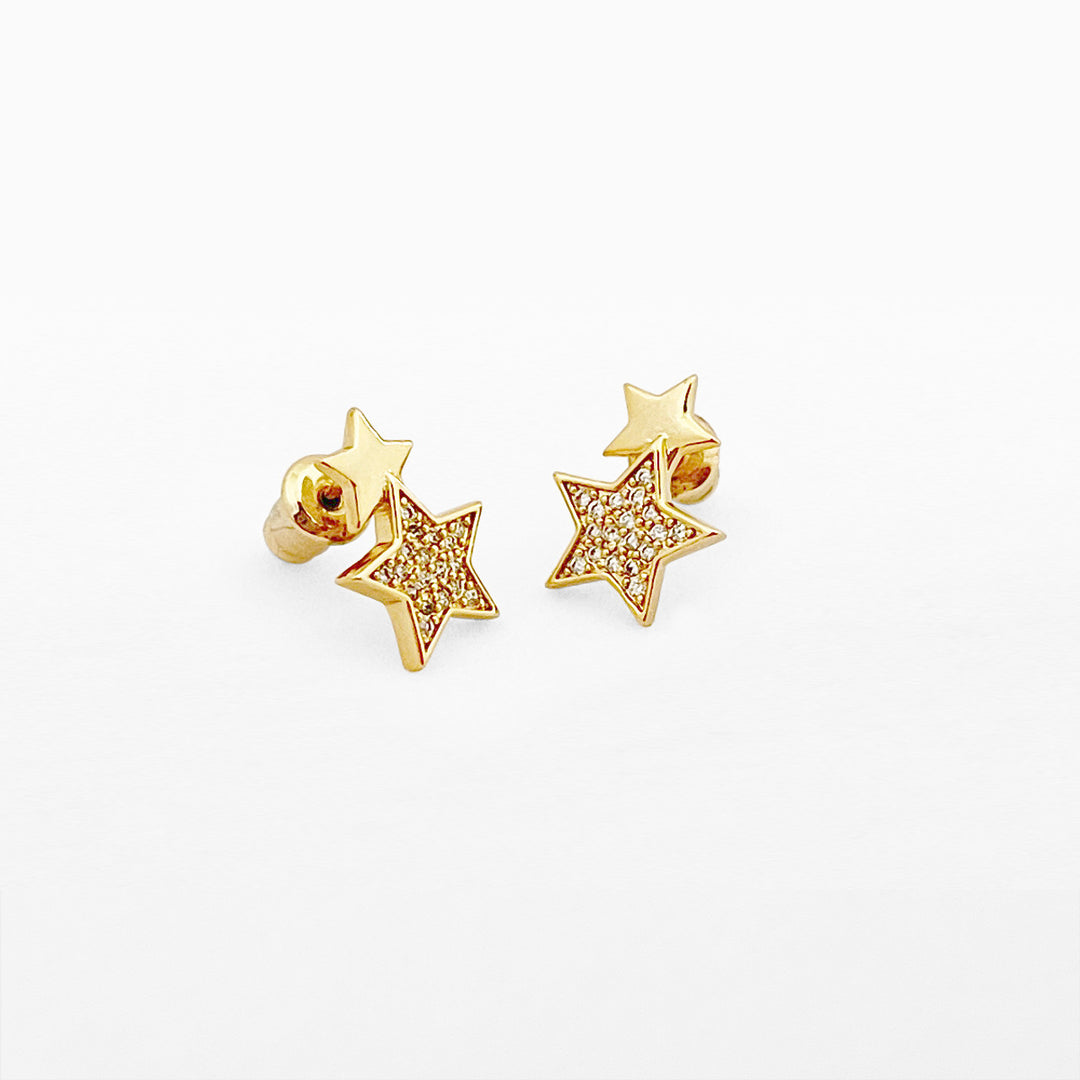 Double gold star stud earrings from Life Charms by Cornucopia Home and Gift, featuring shiny gold star designs on a white background.