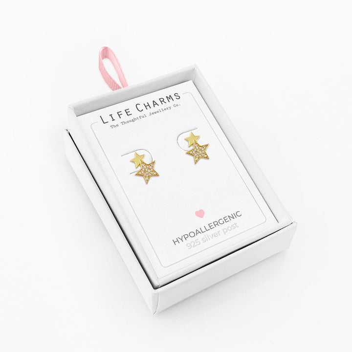 Double gold star stud earrings by Life Charms, featuring shiny gold stars on classic stud posts.