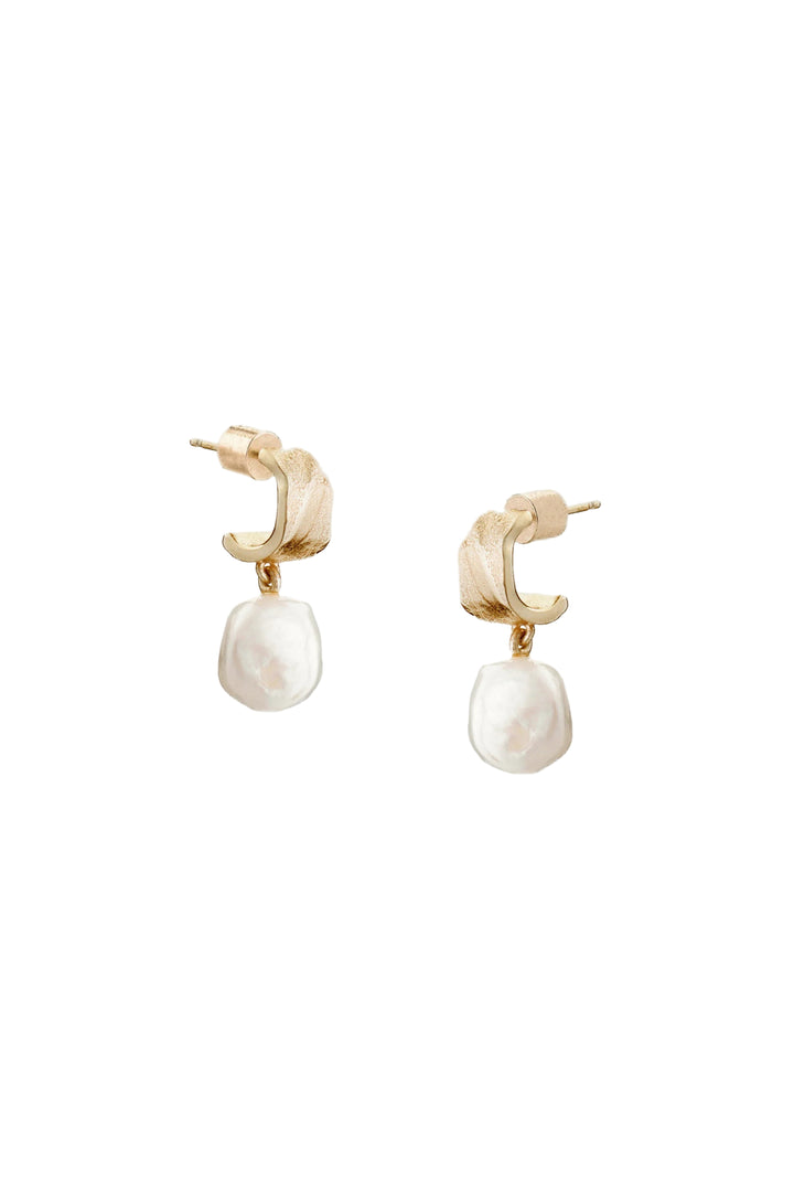 Tutti &amp; Co freshwater pearl earrings featuring lustrous white pearls and silver hooks, elegant jewelry for everyday wear.
