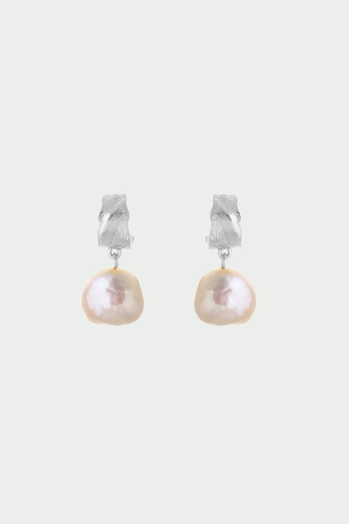 Silver freshwater pearl earrings by Tutti &amp; Co featuring elegant, round pearls on sleek silver hooks.