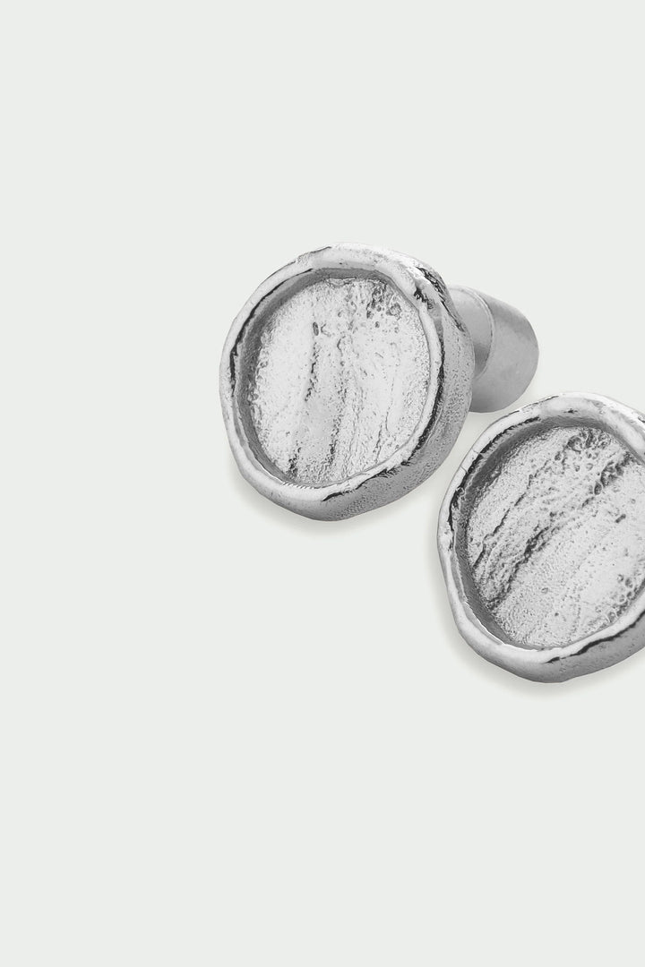 Silver Arc Earrings by Tutti &amp; Co featuring sleek, curved design, perfect for everyday wear and stylish accessories.