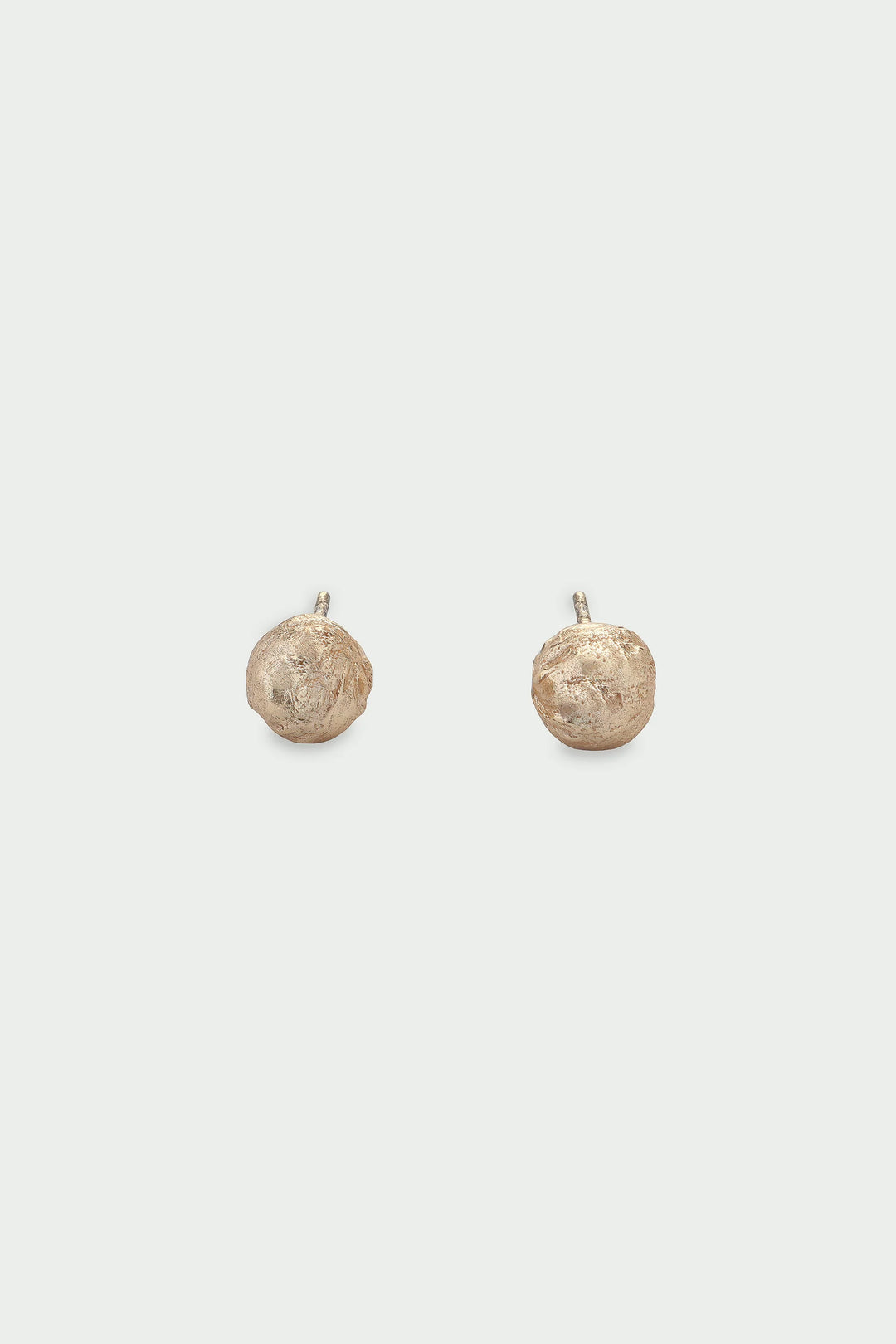 Tutti & Co Sphera Earrings with gold-toned spherical design, hanging from delicate hooks, displayed on a neutral background