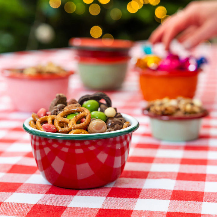 Cranberry enamel bowl by Talking Tables Christmas from Cornucopia Home and Gift, featuring a festive red cranberry design.