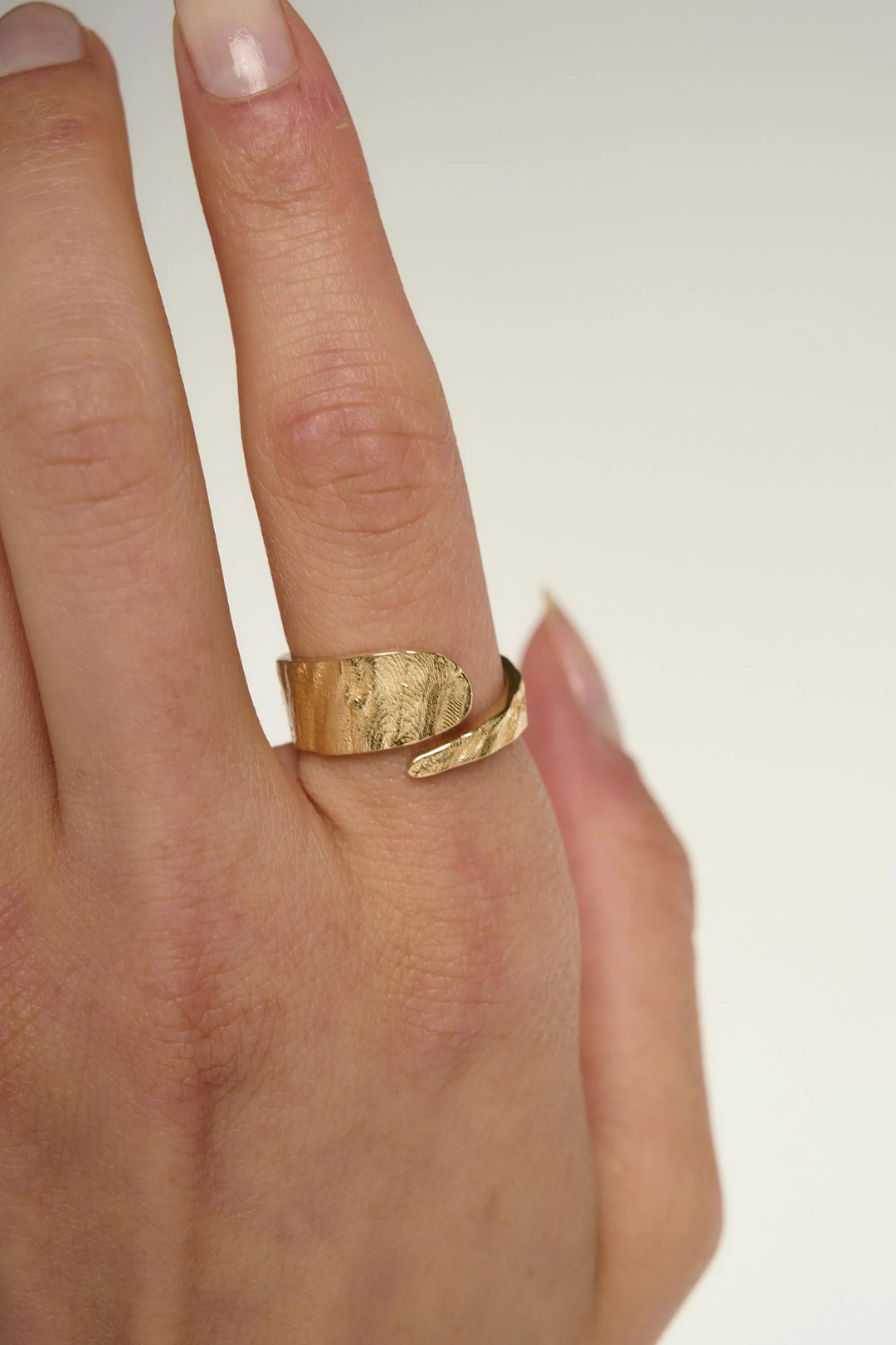 Gold Riva Ring by Tutti &amp; Co, showcasing a stylish, handcrafted jewelry piece with intricate design details on a neutral background.