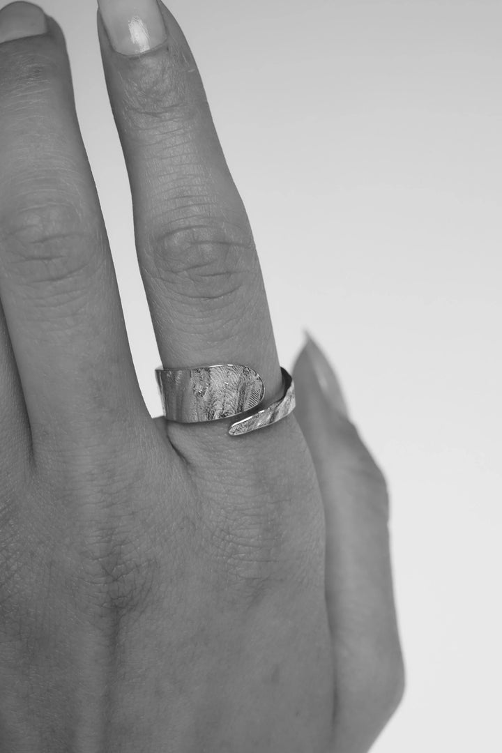 Silver Riva Ring by Tutti &amp; Co featuring a sleek, modern design, displayed on a neutral background.