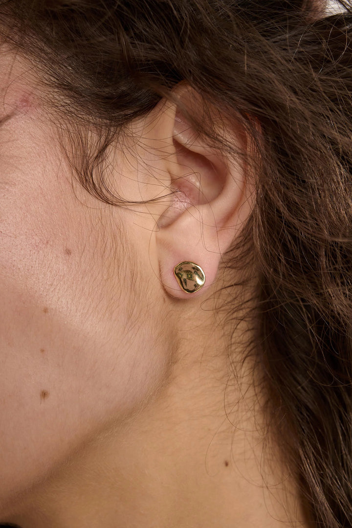 Gold Balance Earrings by Tutti &amp; Co featuring sleek, minimalist design with delicate curved arcs on a white background.