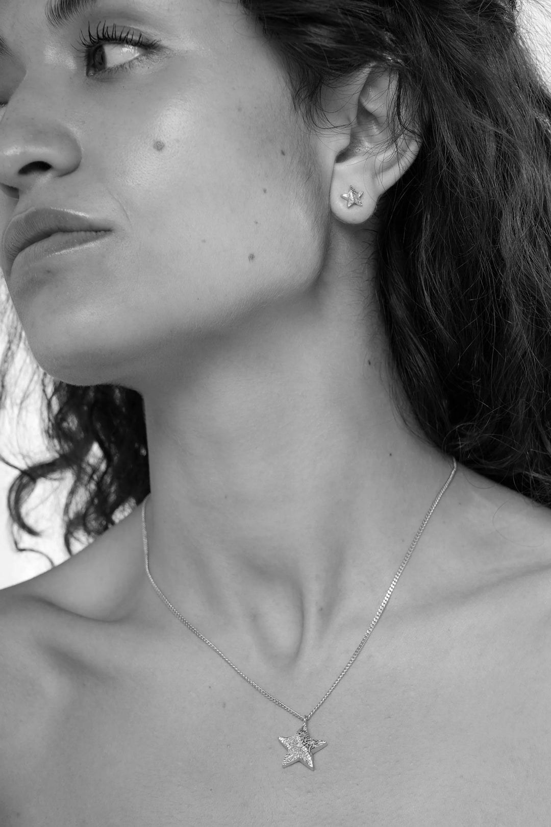 Silver Cosma Necklace by Tutti &amp; Co featuring a delicate chain and elegant pendant, displayed on a neutral background.